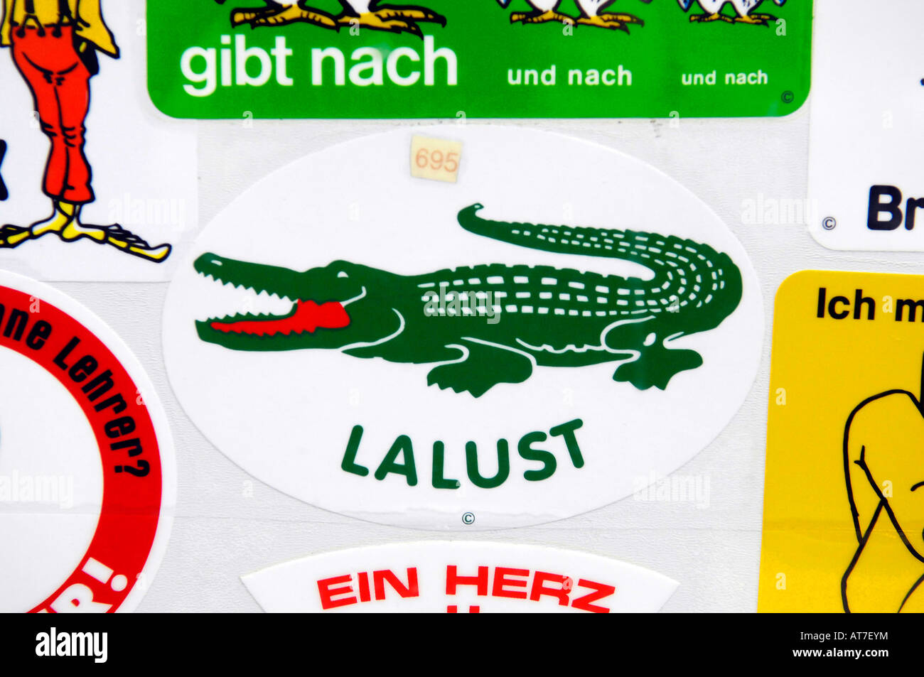 lalust lacoste crocodile comic humour retro souvenir sticker badge berlin  germany europe travel tourism Stock Photo - Alamy