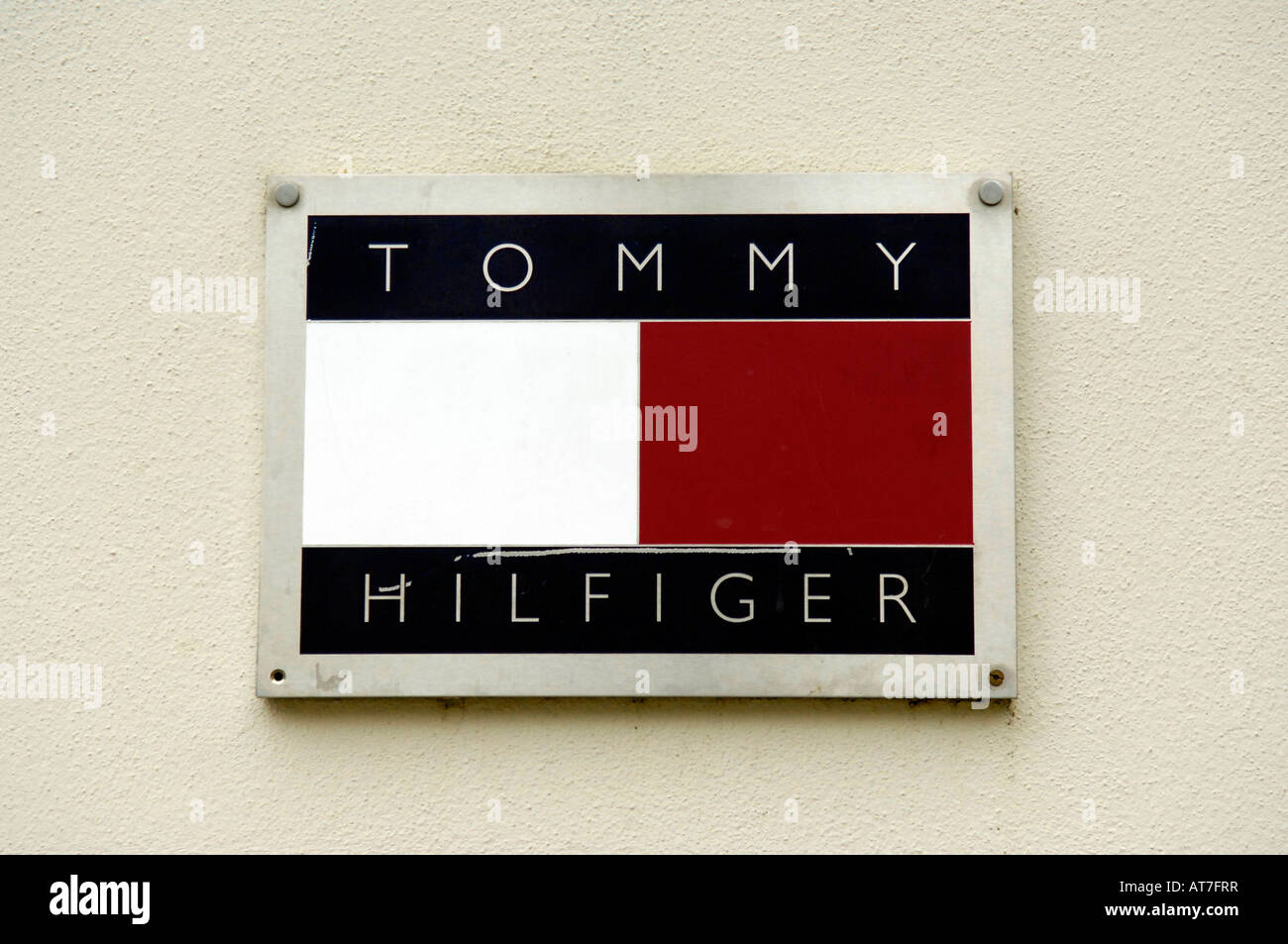tommy hilfiger logo design brand clothes shop display front street city ...