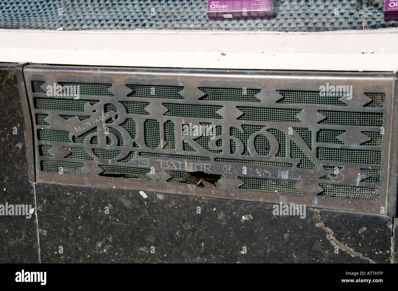 Brass air vent cover grille plate Montague Burton the Tailor of Taste on former clothes store Aberystwyth Wales UK Stock Photo