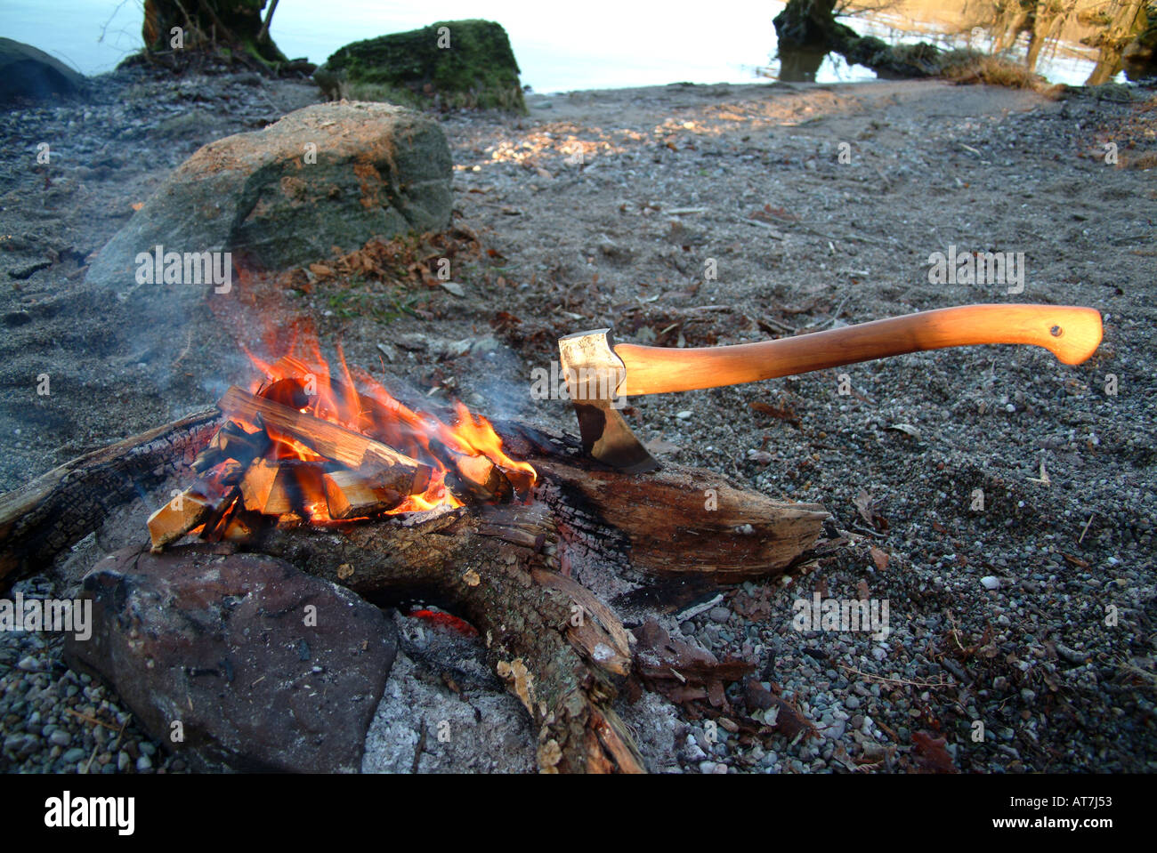 Fire with wood split with axe Stock Photo