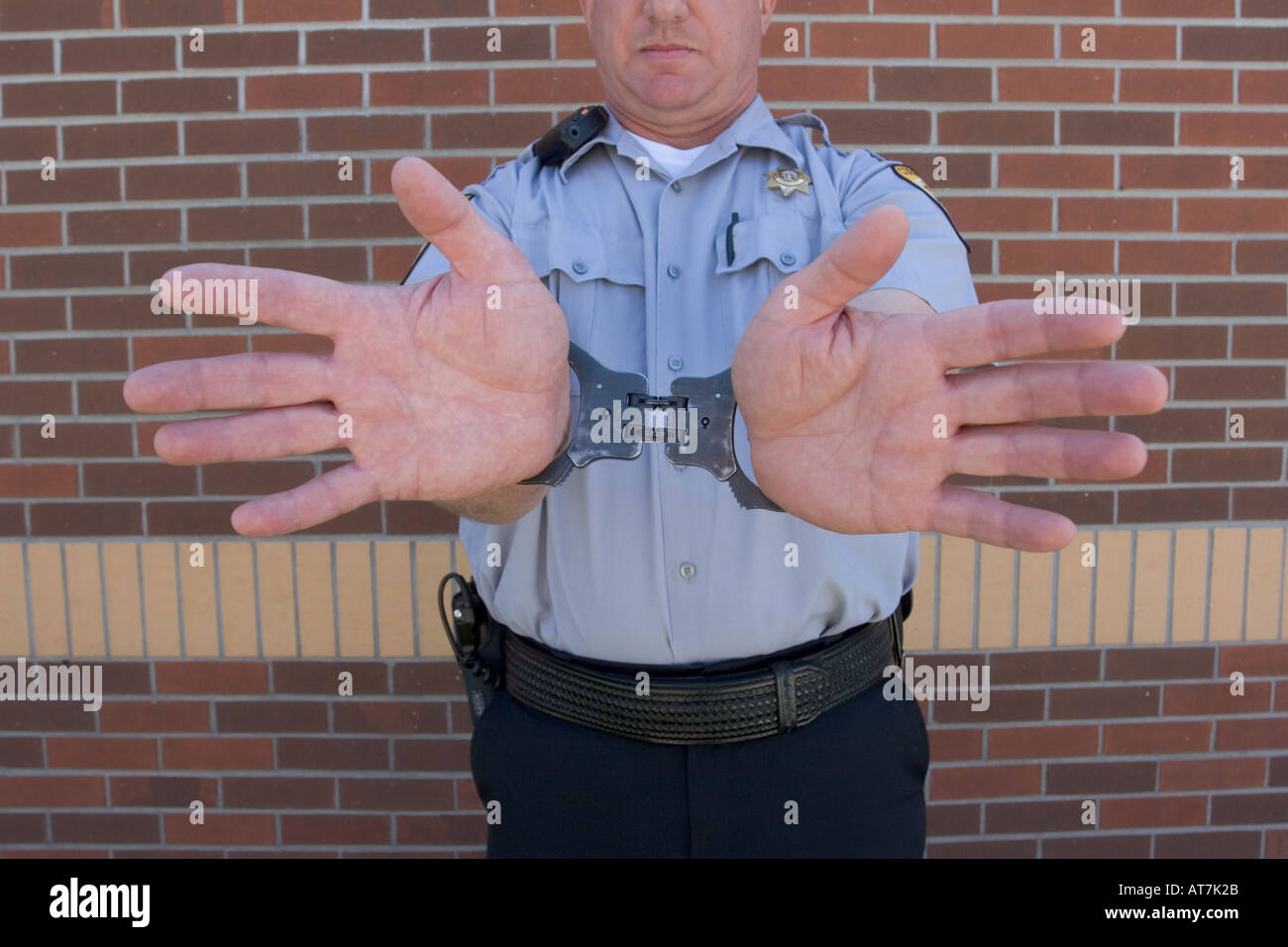 Corrections Officer in handcuffs. Stock Photo
