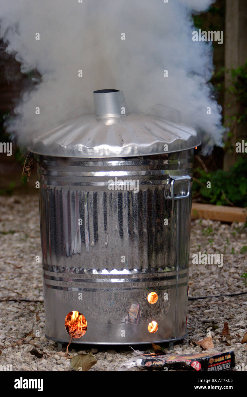 Burning rubbish in a garden incinerator Stock Photo Alamy