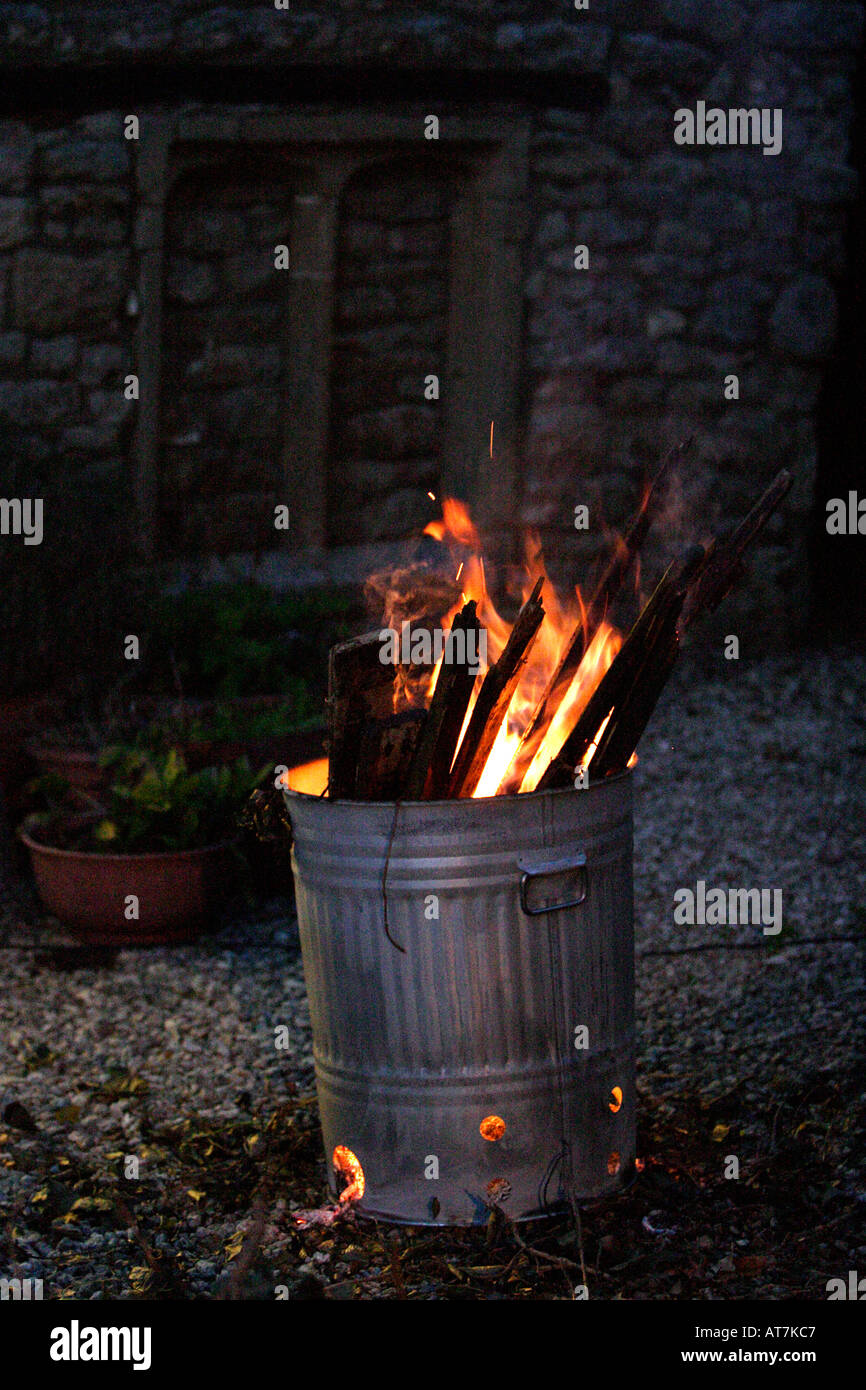 Burning rubbish in a garden incinerator Stock Photo Alamy