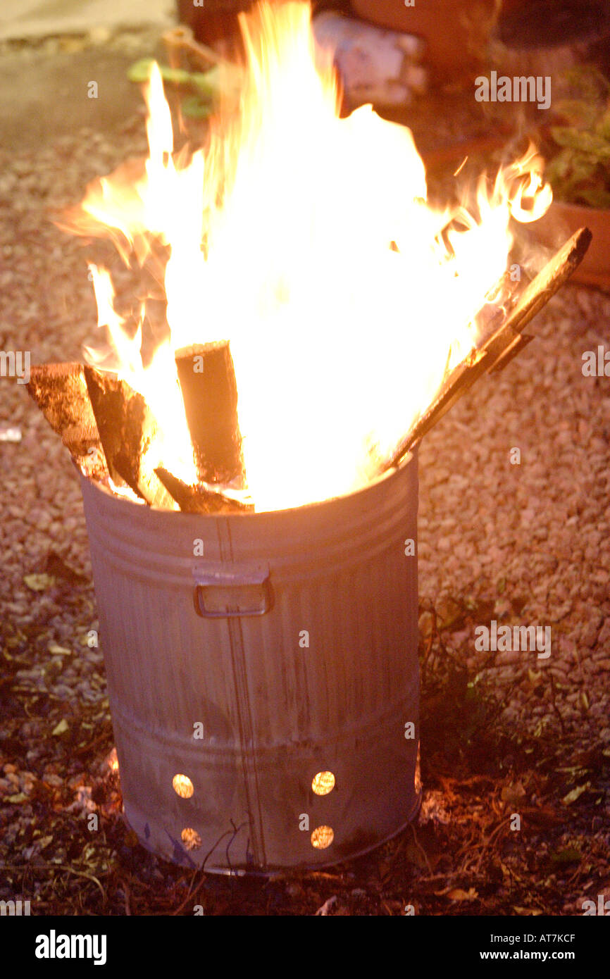 Burning rubbish in a garden incinerator Stock Photo Alamy