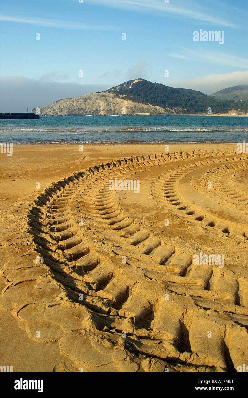 wheel track on sand beach Stock Photo