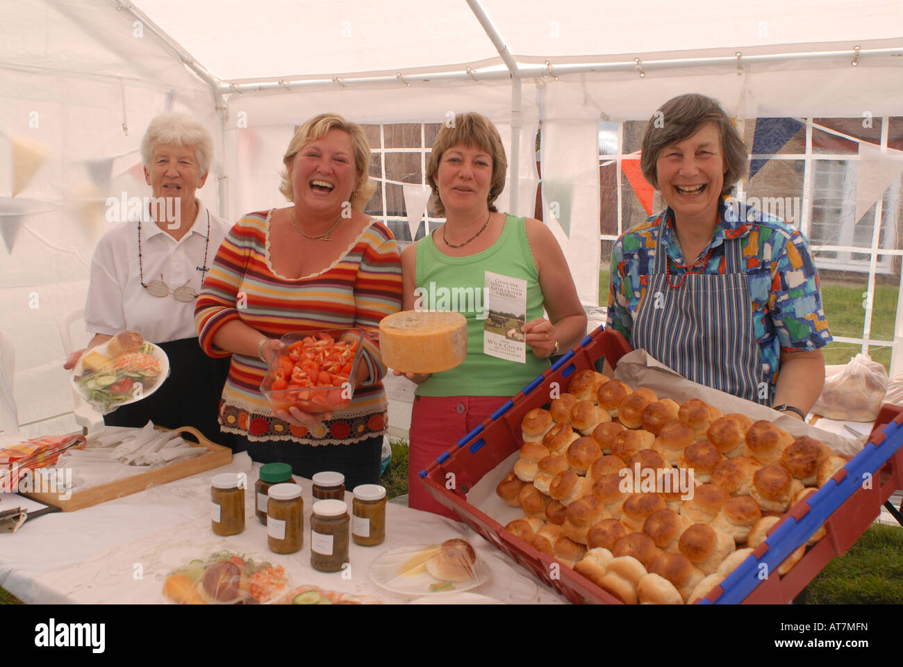 ladies with snacks for sale at traditional village fete Stock Photo Alamy