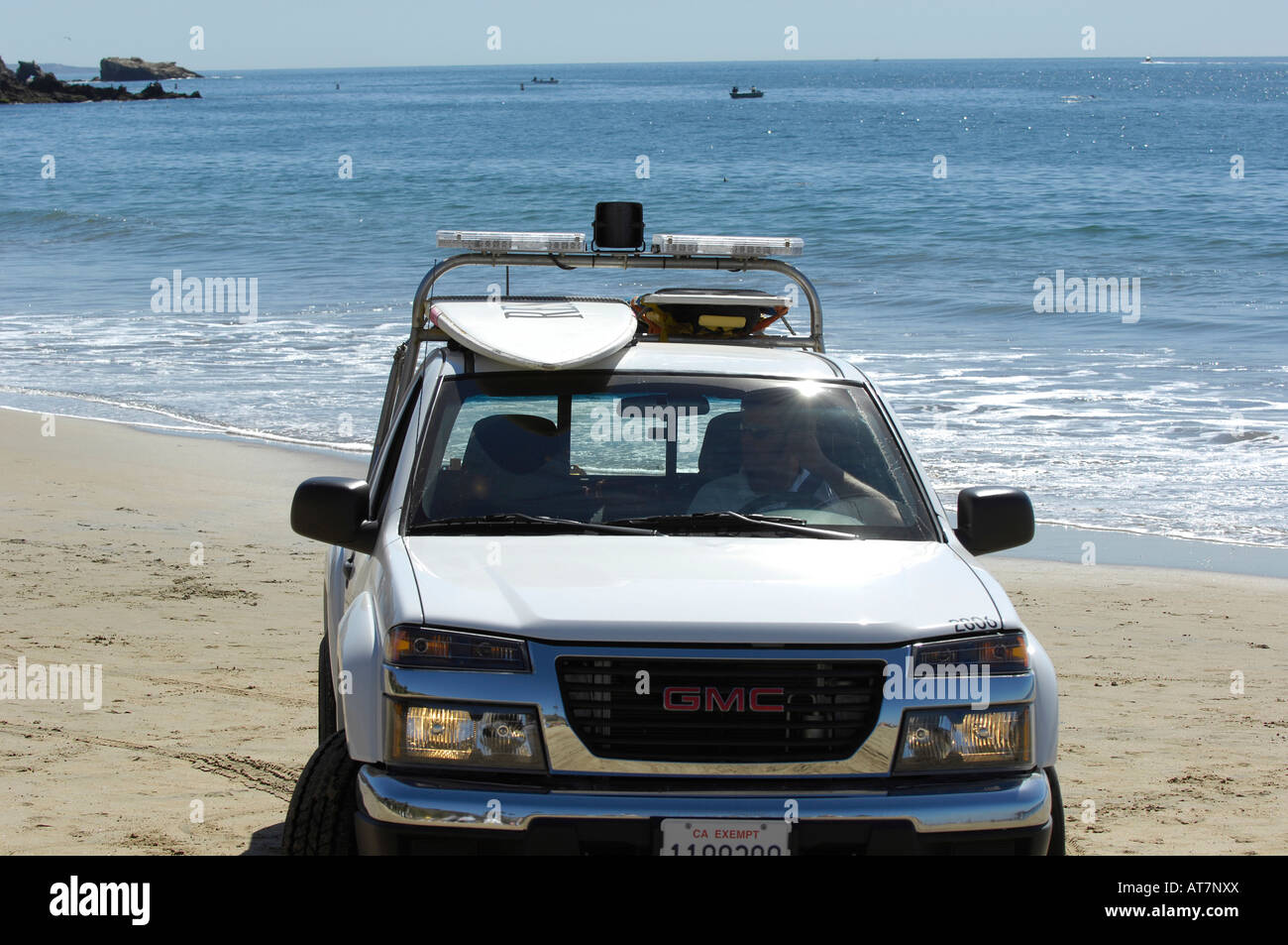 LED lights on an emergency vehicle allow first responders to be highly visible, Lifeguard rescue truck with surf board. Stock Photo