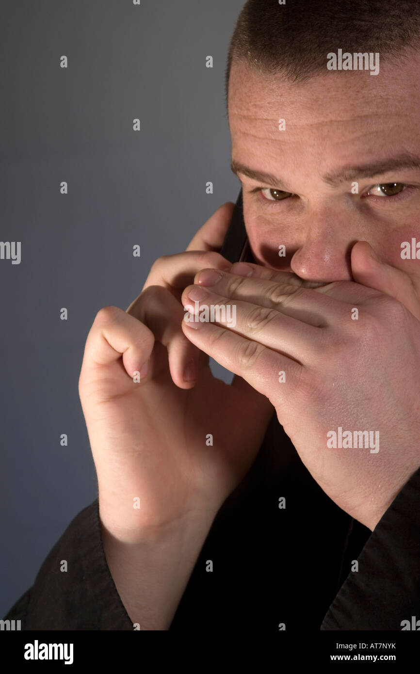 Covert use of mobile phone Stock Photo