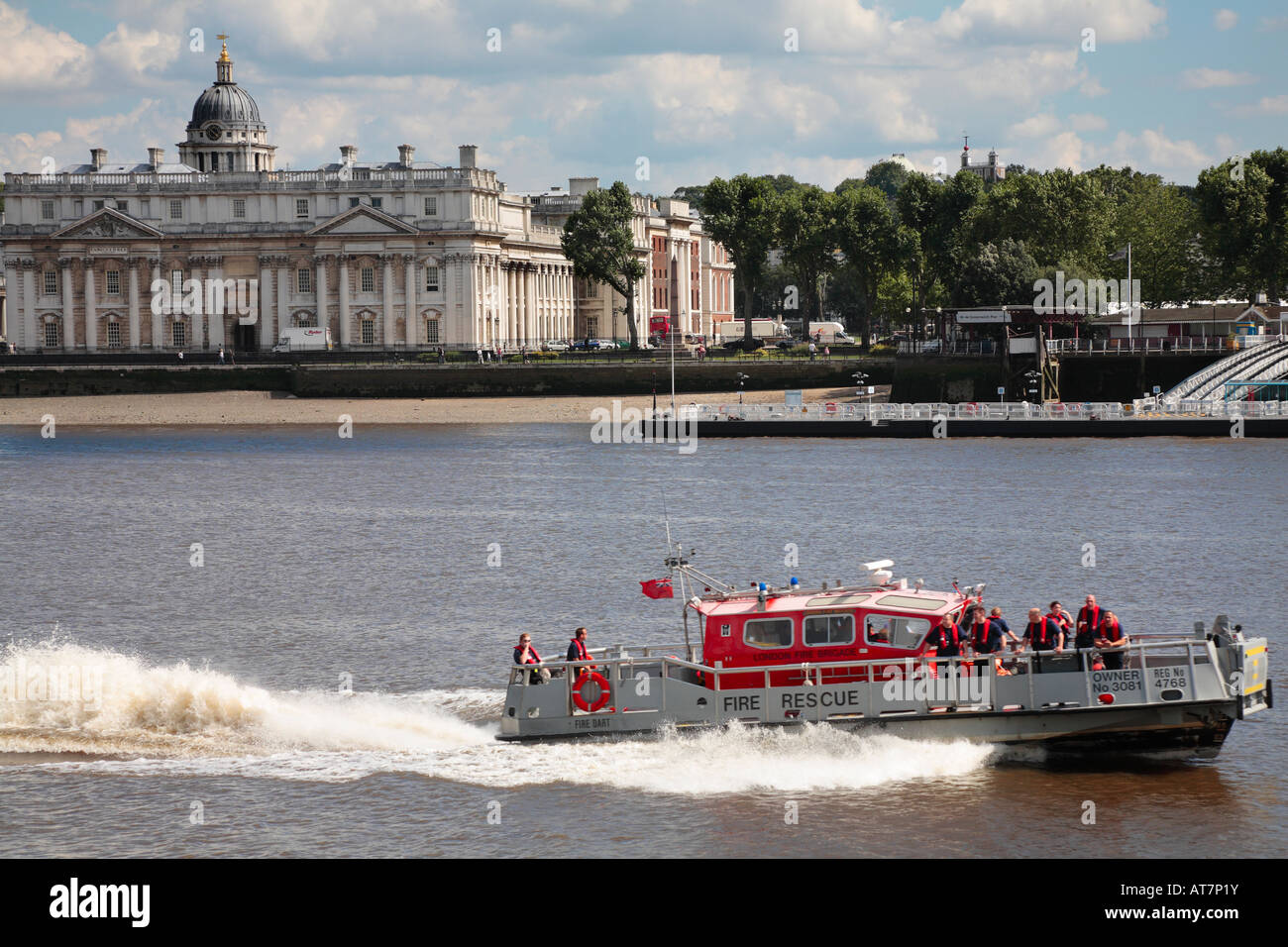 London Fire Brigade Fire and Rescue Boat on the River Thames with The Old Royal Naval College, Greenwich. Stock Photo