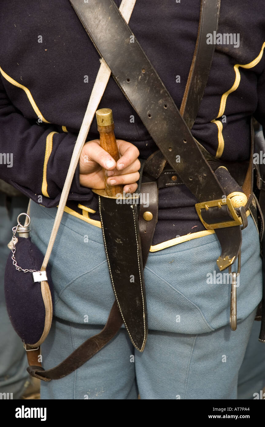 Close up of soldiers hand holding knife on his back belt at Civil