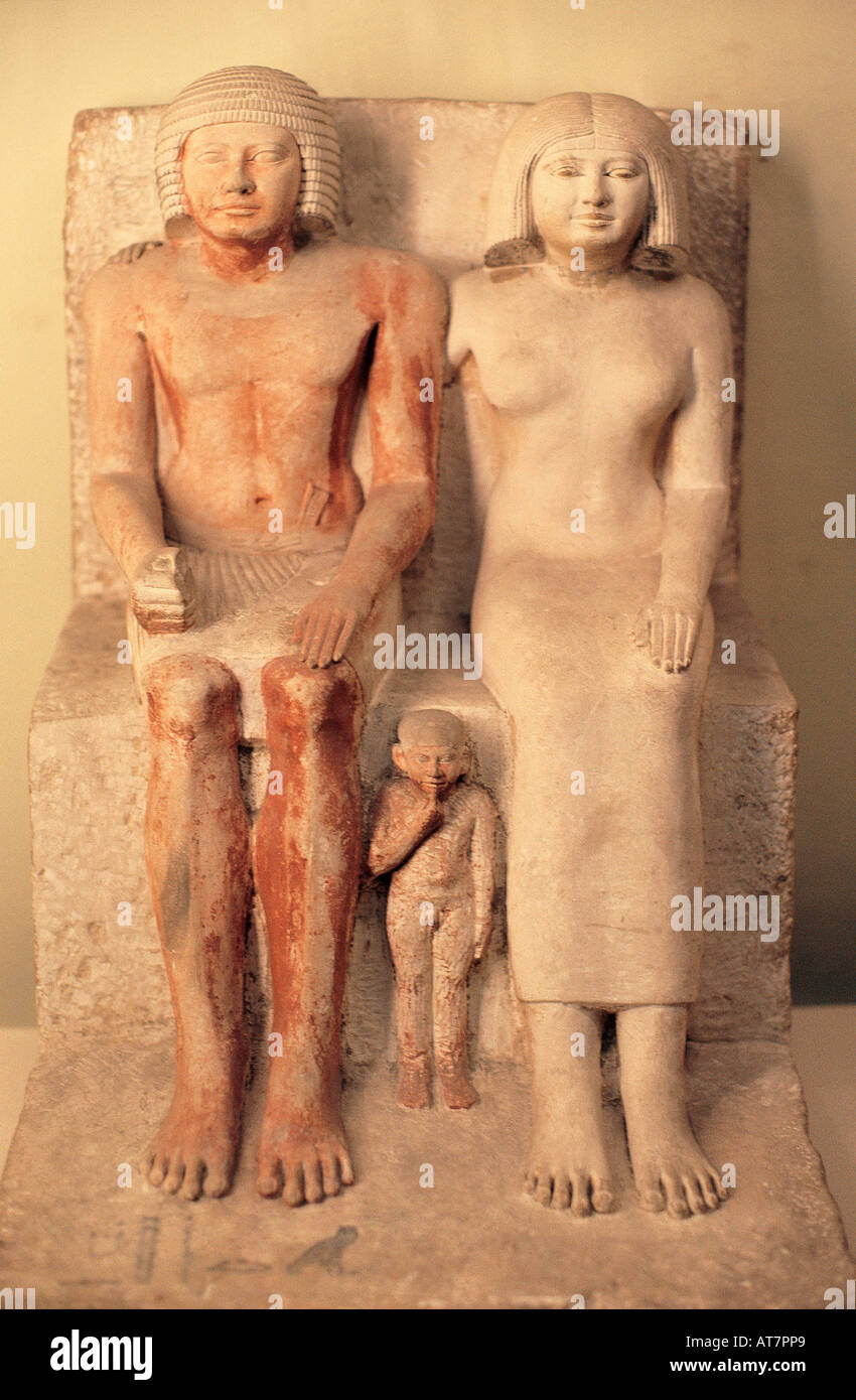 Carved stone model of an unknown man and woman with a child Egyptian Museum Cairo Egypt Stock Photo