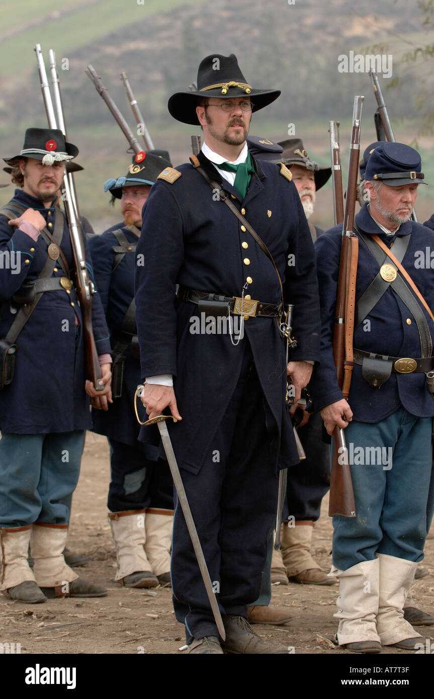 Officer and soldiers preparing for salute at Civil War reenactment event Stock Photo