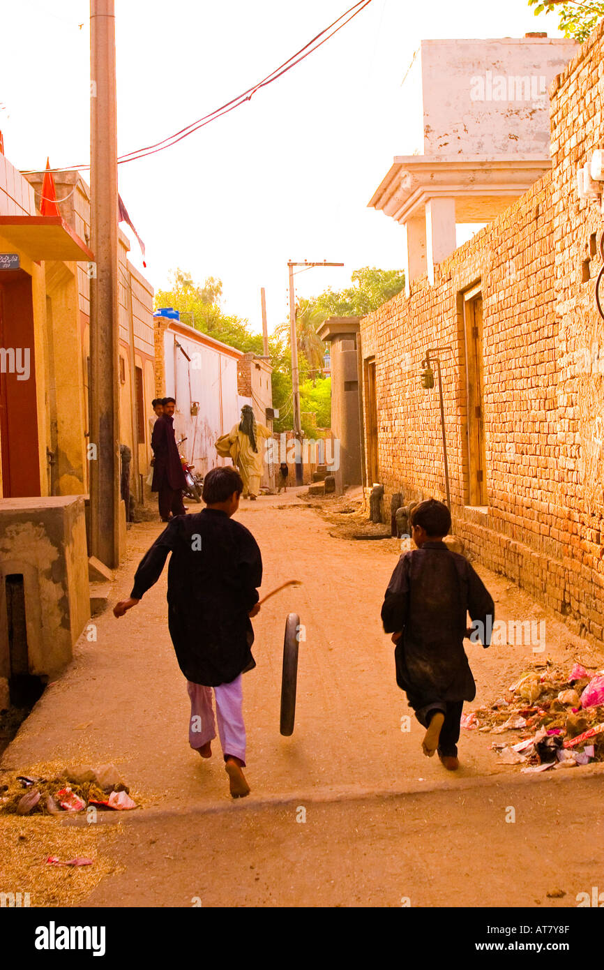 Children playing along the streets of Uch Sharif Uch Sharif Pakistan Stock Photo