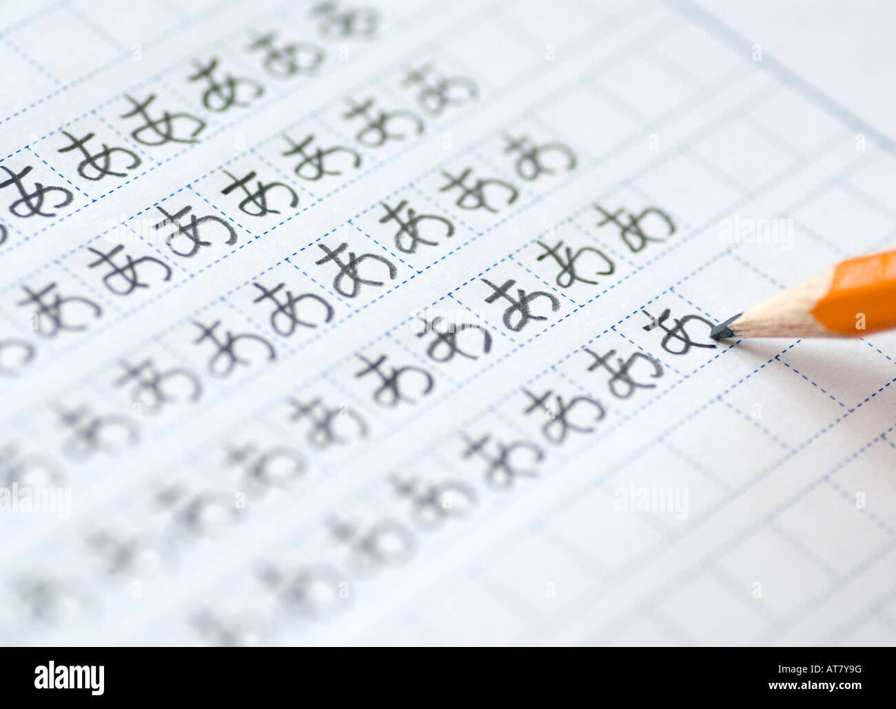 Foreign student learning to write Japanese hiragana characters by