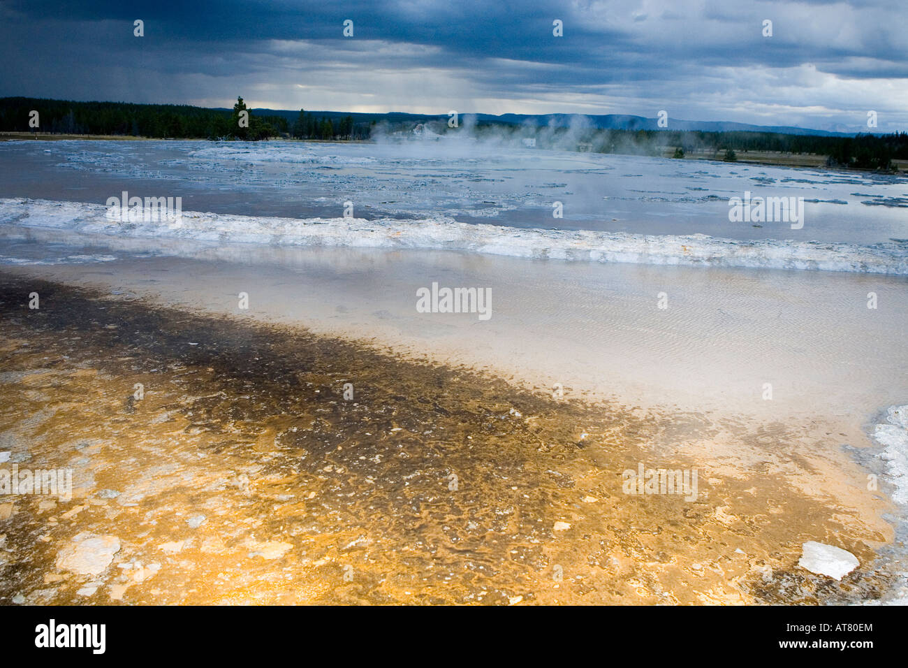 Near Surprise Pool, Yellowstone National Park a pool filled with steaming water Stock Photo