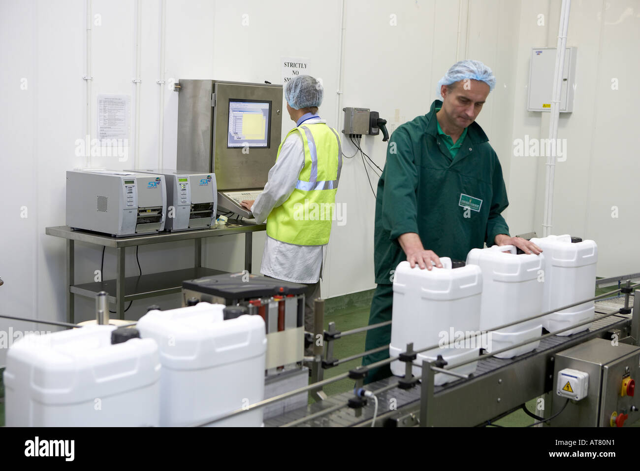Bulk liquid containers on production line Stock Photo Alamy