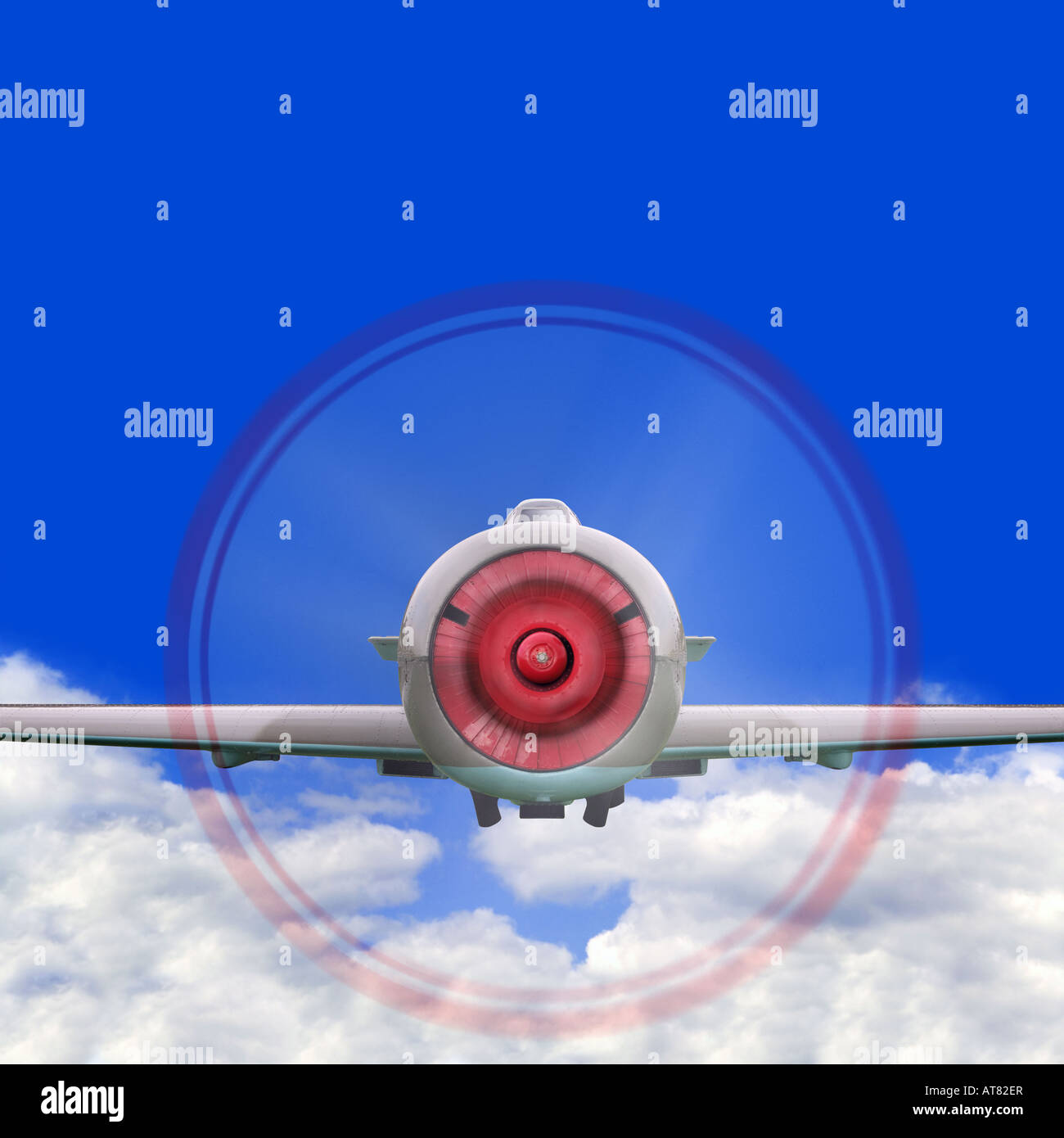 Old single propeller fighter plane flying above the clouds Stock Photo