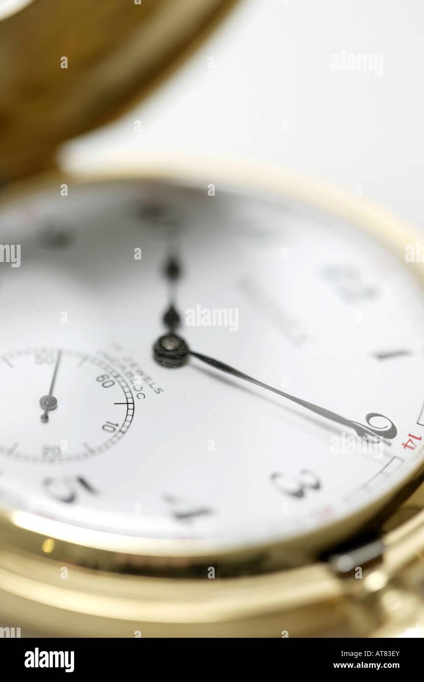 close up of gold watch face, time piece close up, gold half hunter