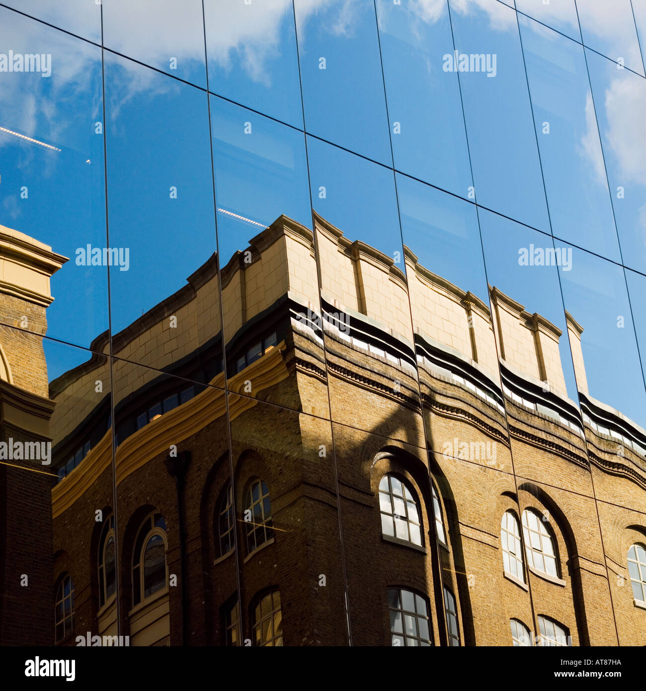 Sky reflects in modern office windows Stock Photo - Alamy
