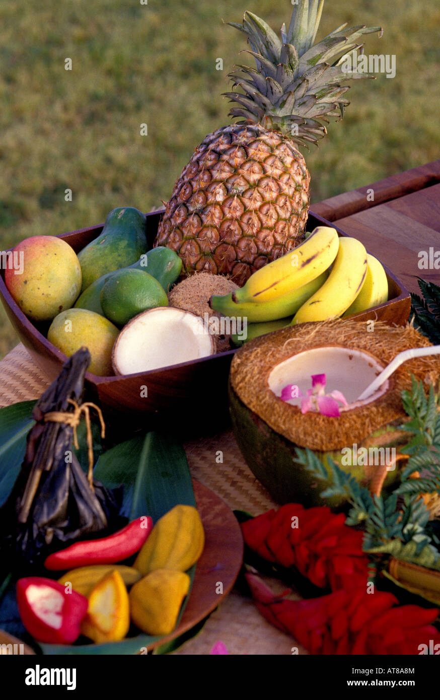 Arrangement of tropical fruits including pineapple, banana, mango, coconut and papaya Stock Photo