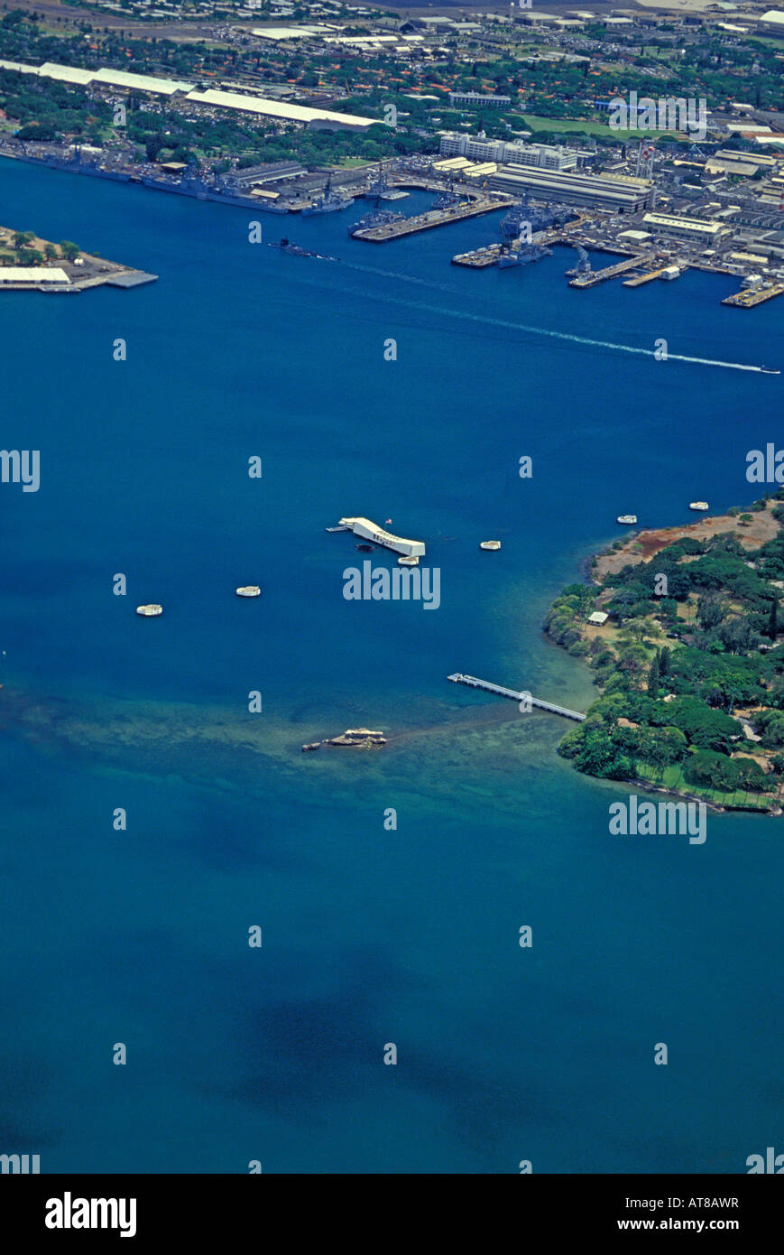 Vertical aerial shot of Pearl Harbor with the  Arizona Memorial in the center of photo. Stock Photo