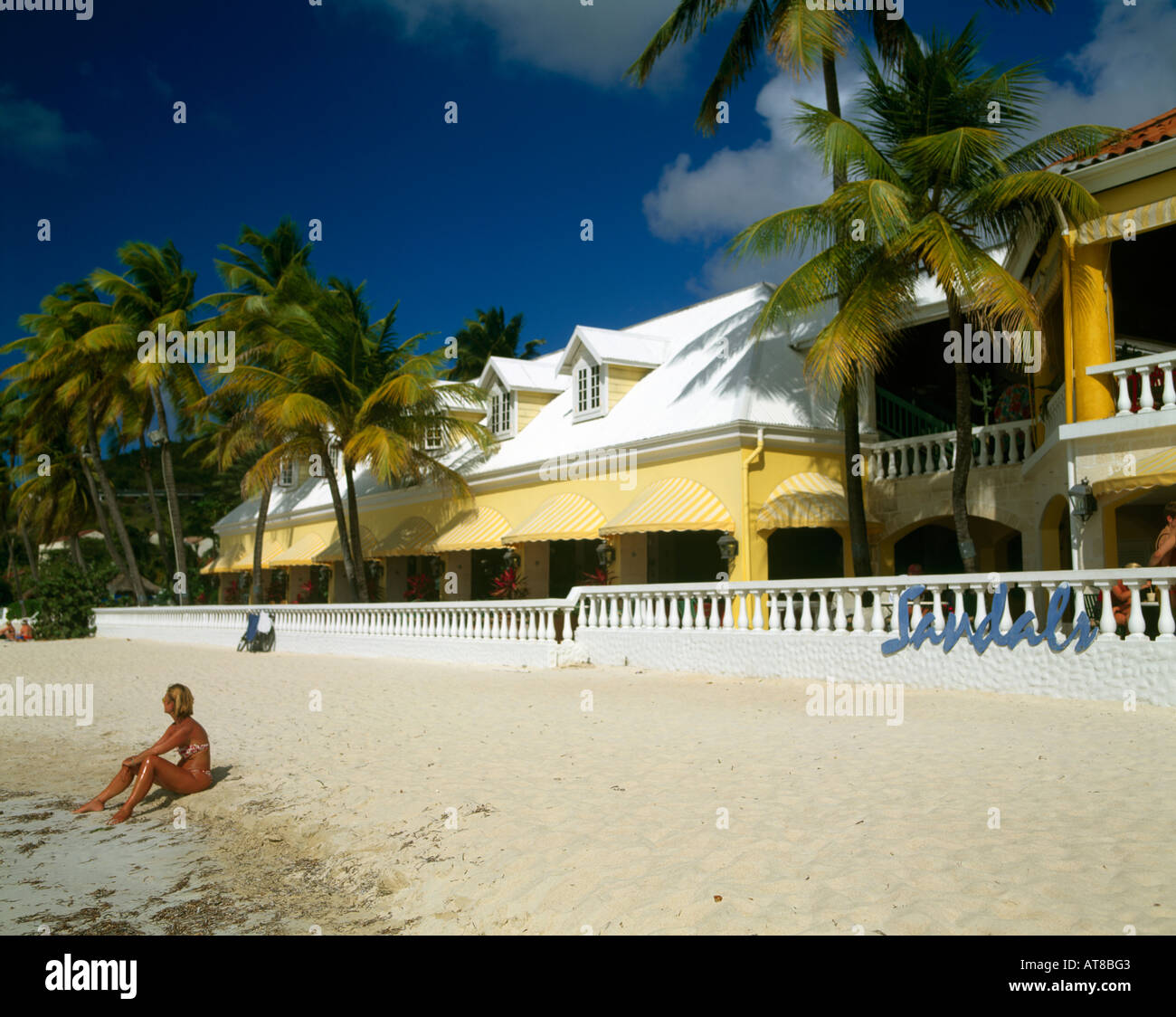 Dickenson Bay Antigua Woman On The Beach Outside Sandals Hotel Stock Photo