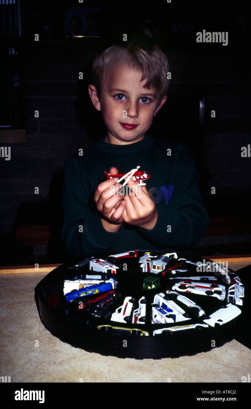 Boy with a collection of toy cars Stock Photo - Alamy