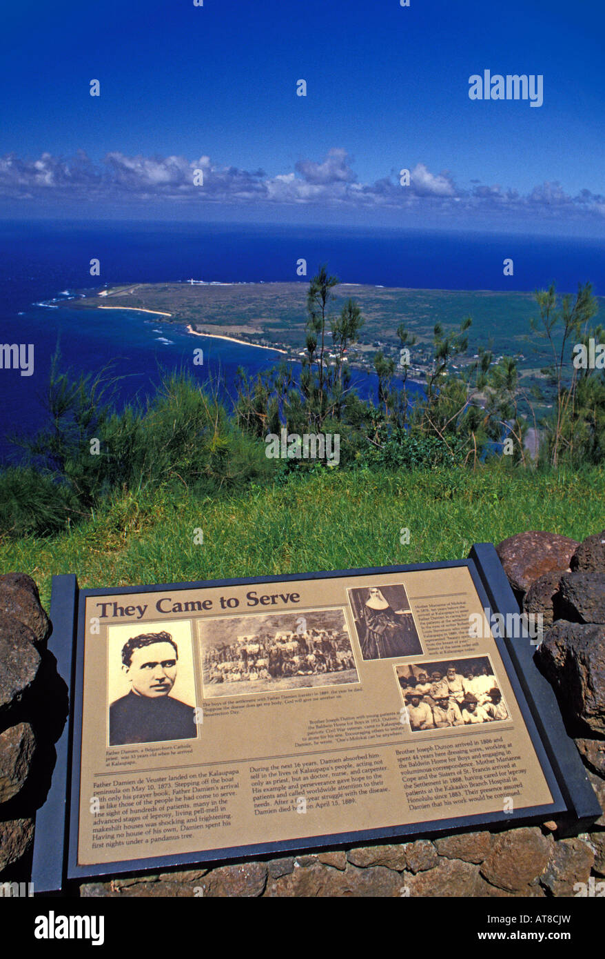 View of Kalaupapa peninsula on Molokai with historic plaque commemorating the missionaries who served the leper colony. Stock Photo