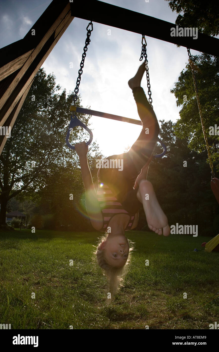 Child swinging upside down Stock Photo Alamy