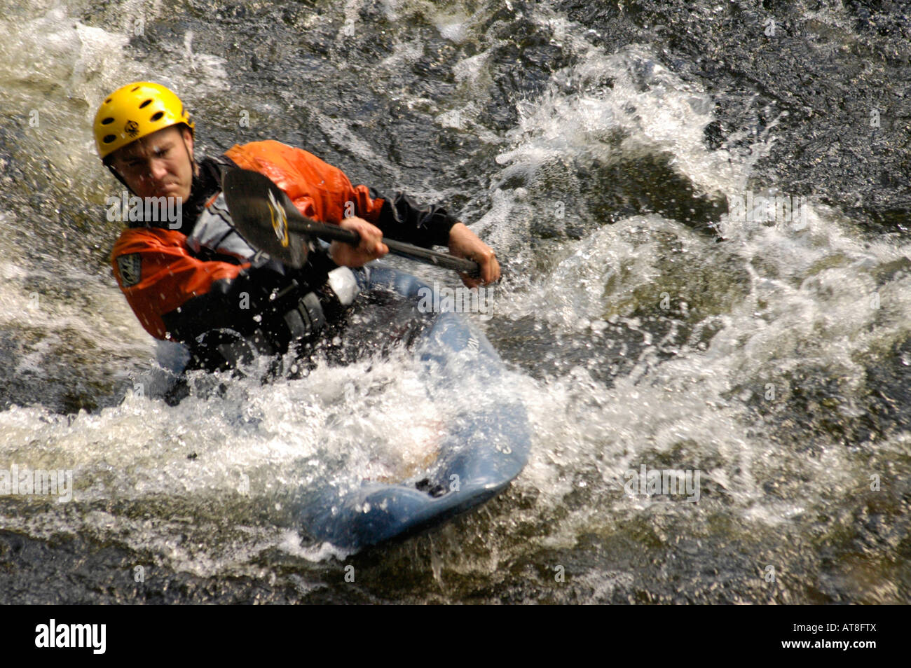 Canoeist in white water on the River Teifi, Llandysul Stock Photo
