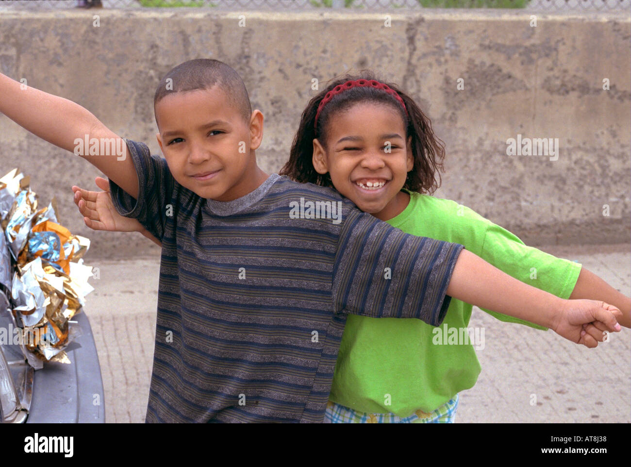 Black siblings age 9 and 7 celebrating at Cinco de Mayo Festival. St Paul Minnesota USA Stock Photo