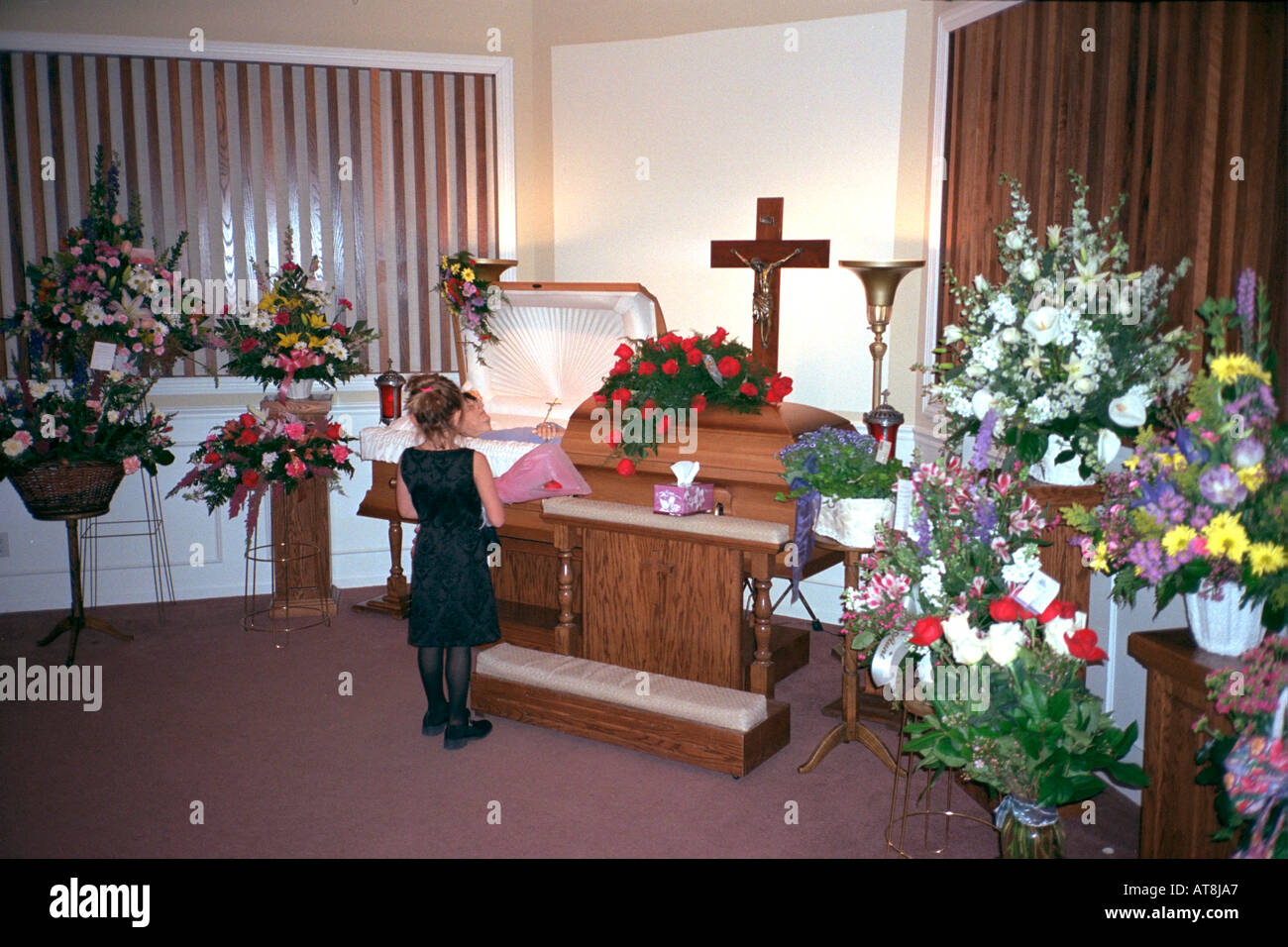 Girl age 7 paying last respects at Grandma's wake service. Brooklyn