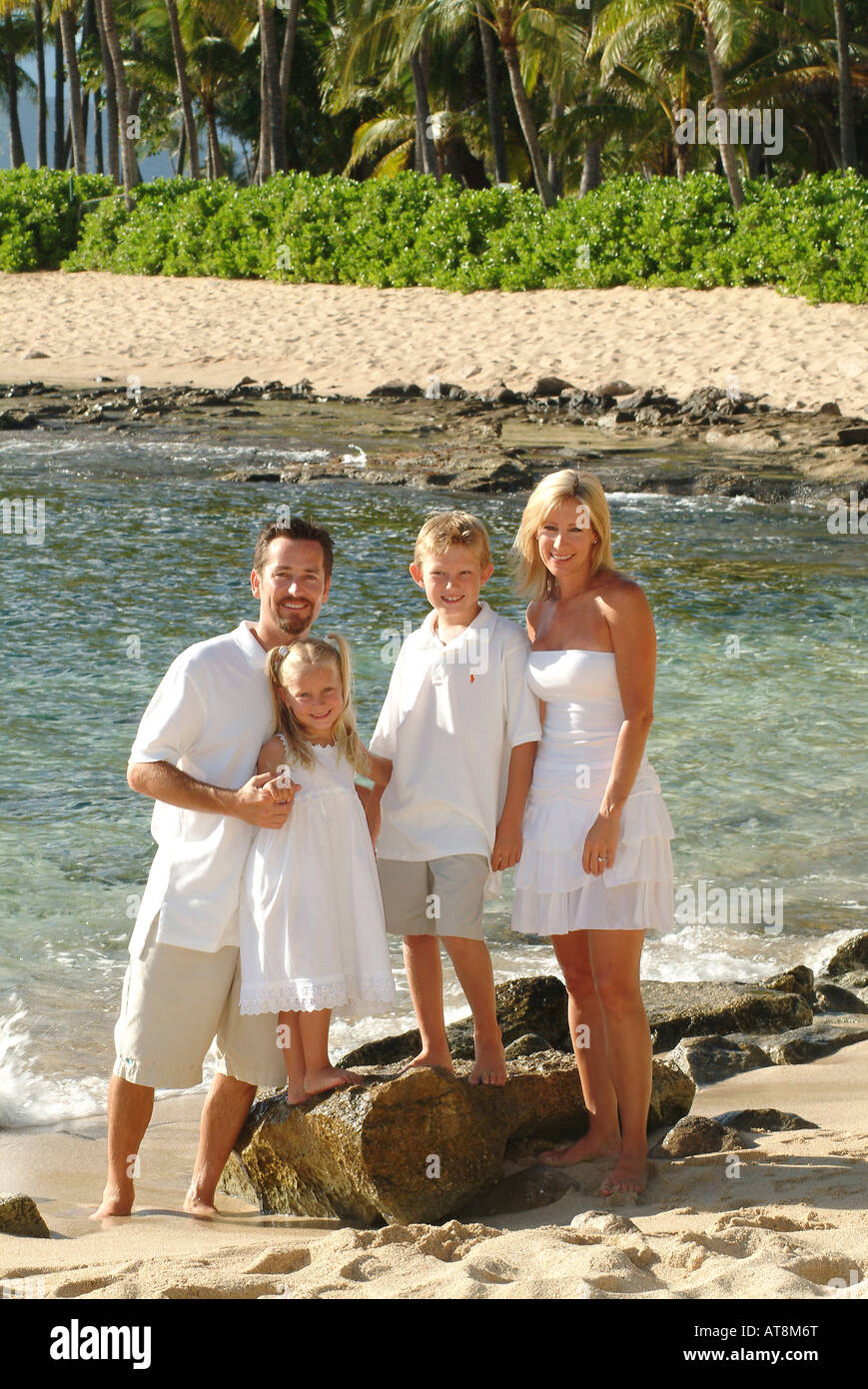 Family of four with mom dad sister and brother hi-res stock