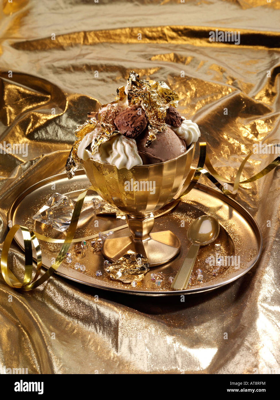 Extravagant gold leaf chocolate truffles and icecream dessert editorial food Stock Photo