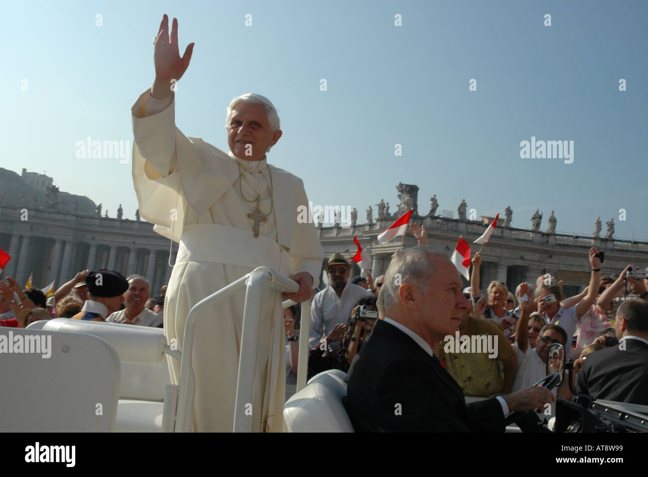 Pope Benedict XVI greets pilgrims attending a papal audience in Rome's St Peter Square, the basilica's huge piazza Stock Photo