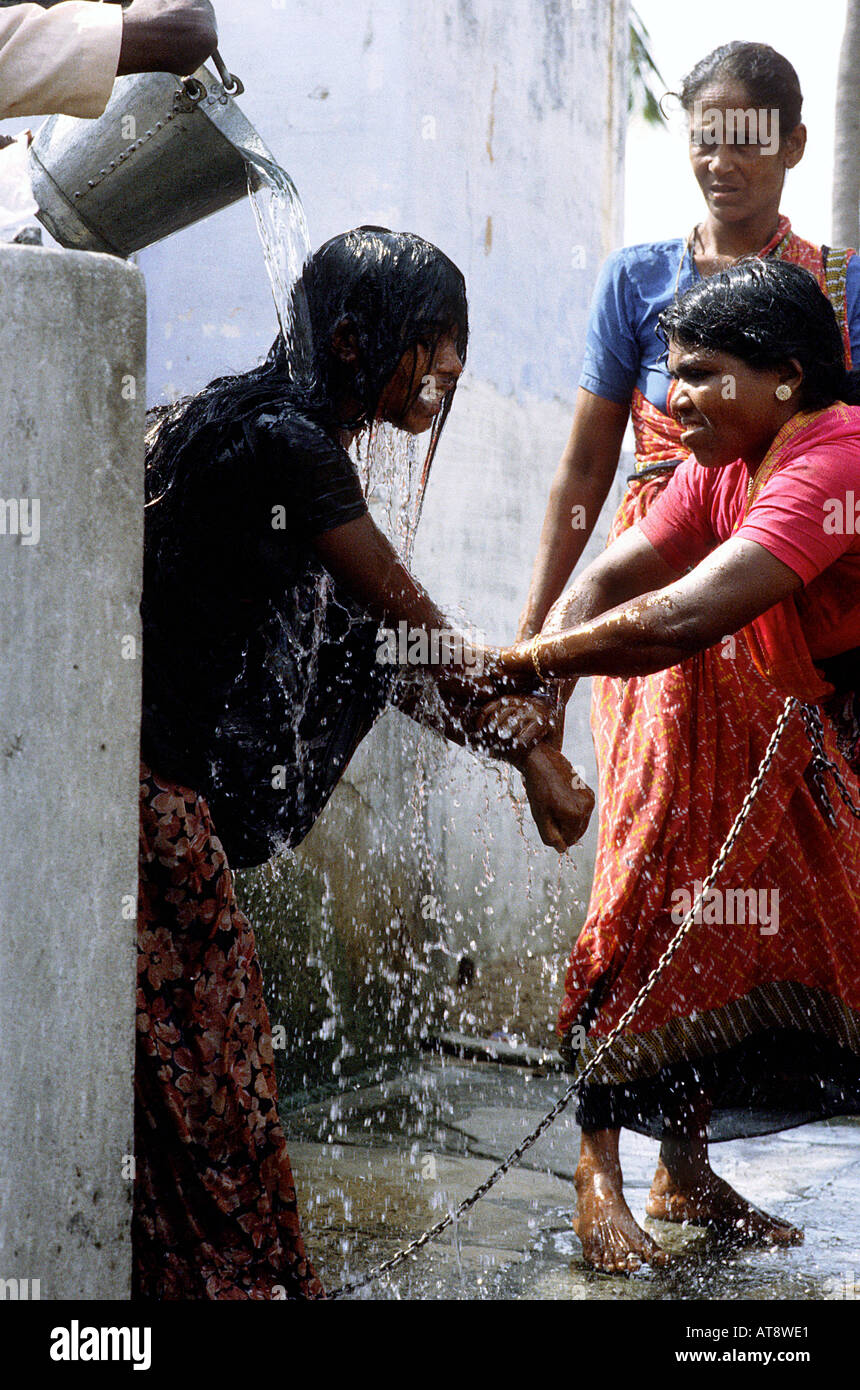 TAMIL NADU MARCH 1994. MADNESS, forced shower Stock Photo Alamy