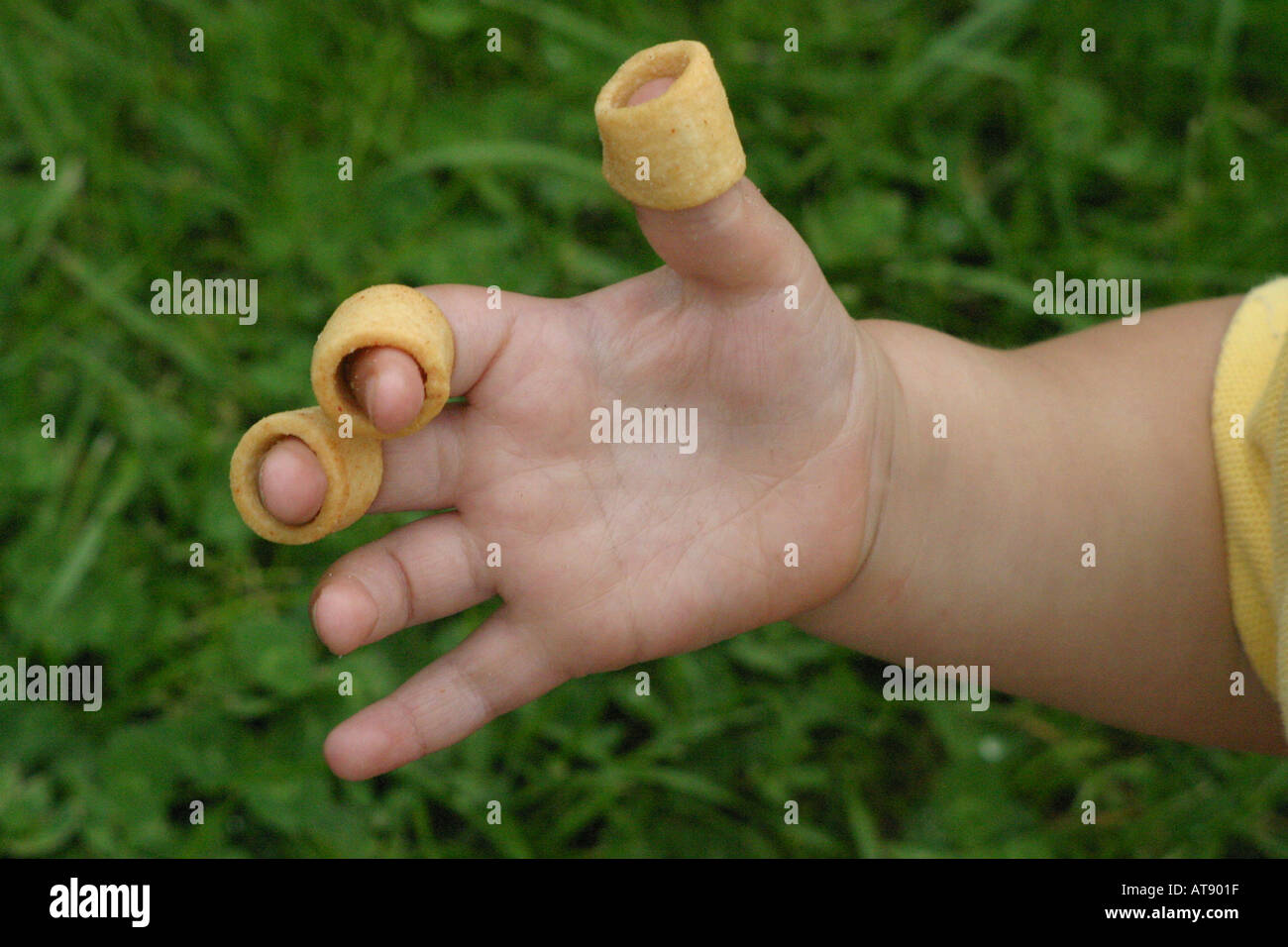 Hula Hoops on a child s hand Stock Photo