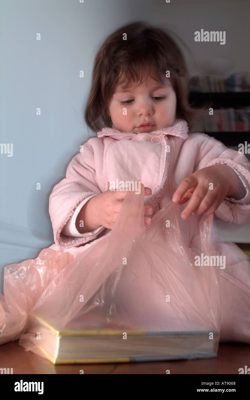 infant playing with a plastic bag Stock Photo Alamy