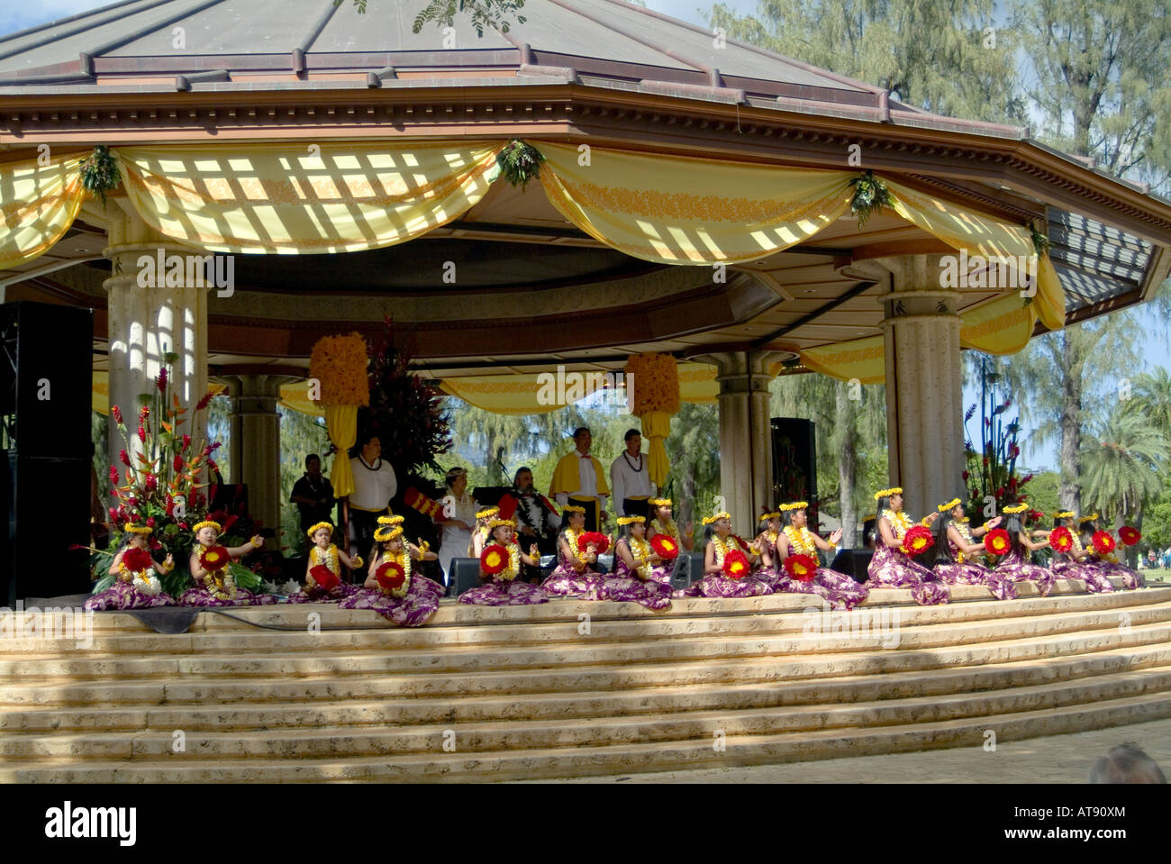 Hula dancers perform at Kapiolani park bandstand on May day, also known