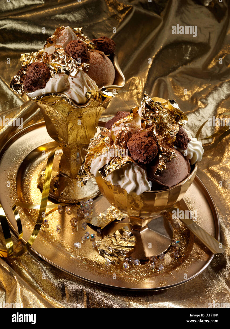 Extravagant gold leaf chocolate truffles and icecream dessert editorial food Stock Photo