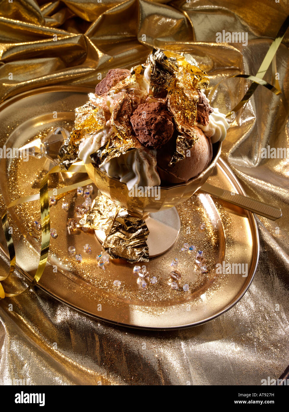 Extravagant gold leaf chocolate truffles and icecream dessert editorial food Stock Photo