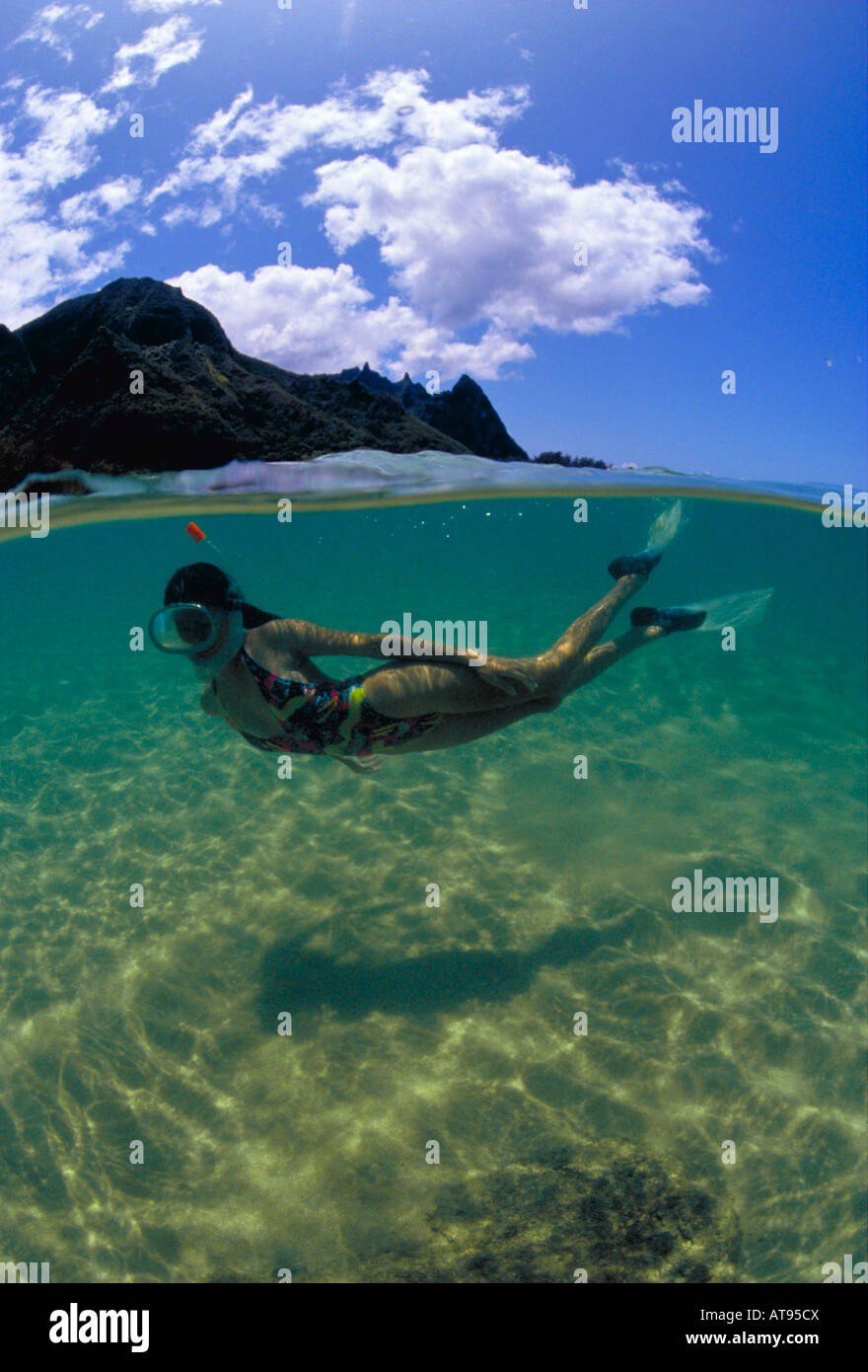 Woman snorkeling off Na pali coast, Kauai Stock Photo Alamy