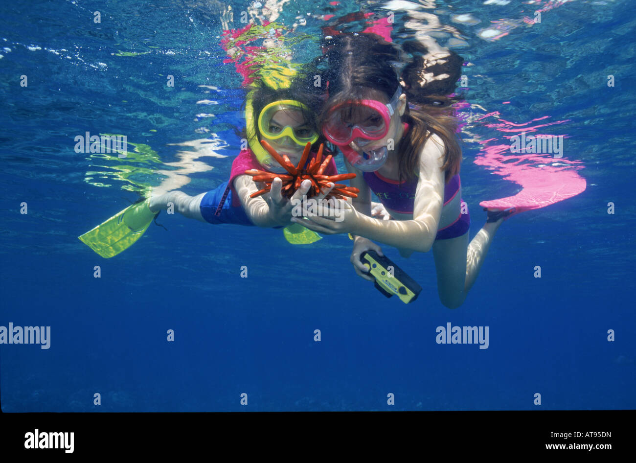 Two young girls snorkeling hi-res stock photography and images - Alamy