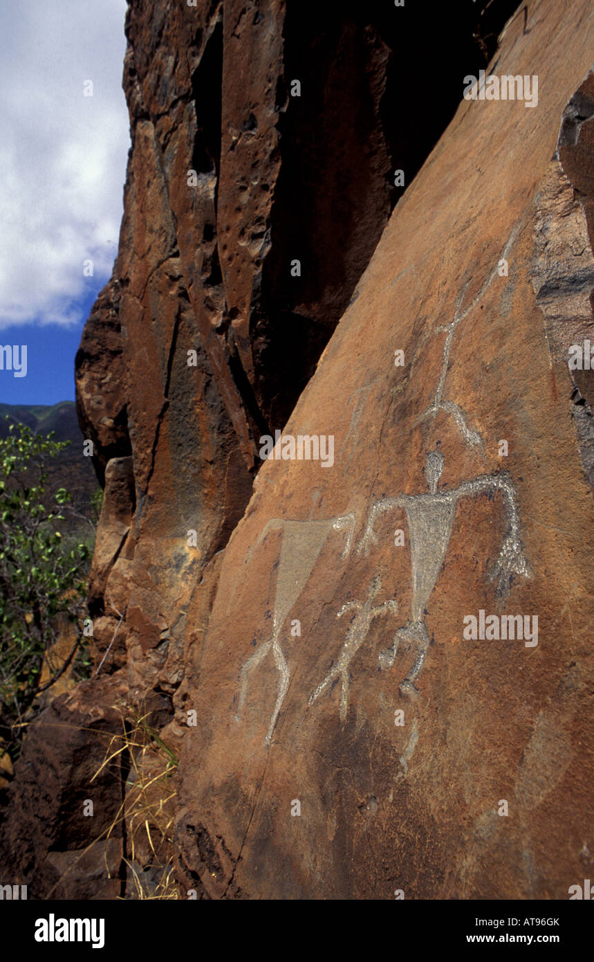 Well preserved Native Hawaiian petroglyphs on a rock face in Olowalu, Maui. Stock Photo