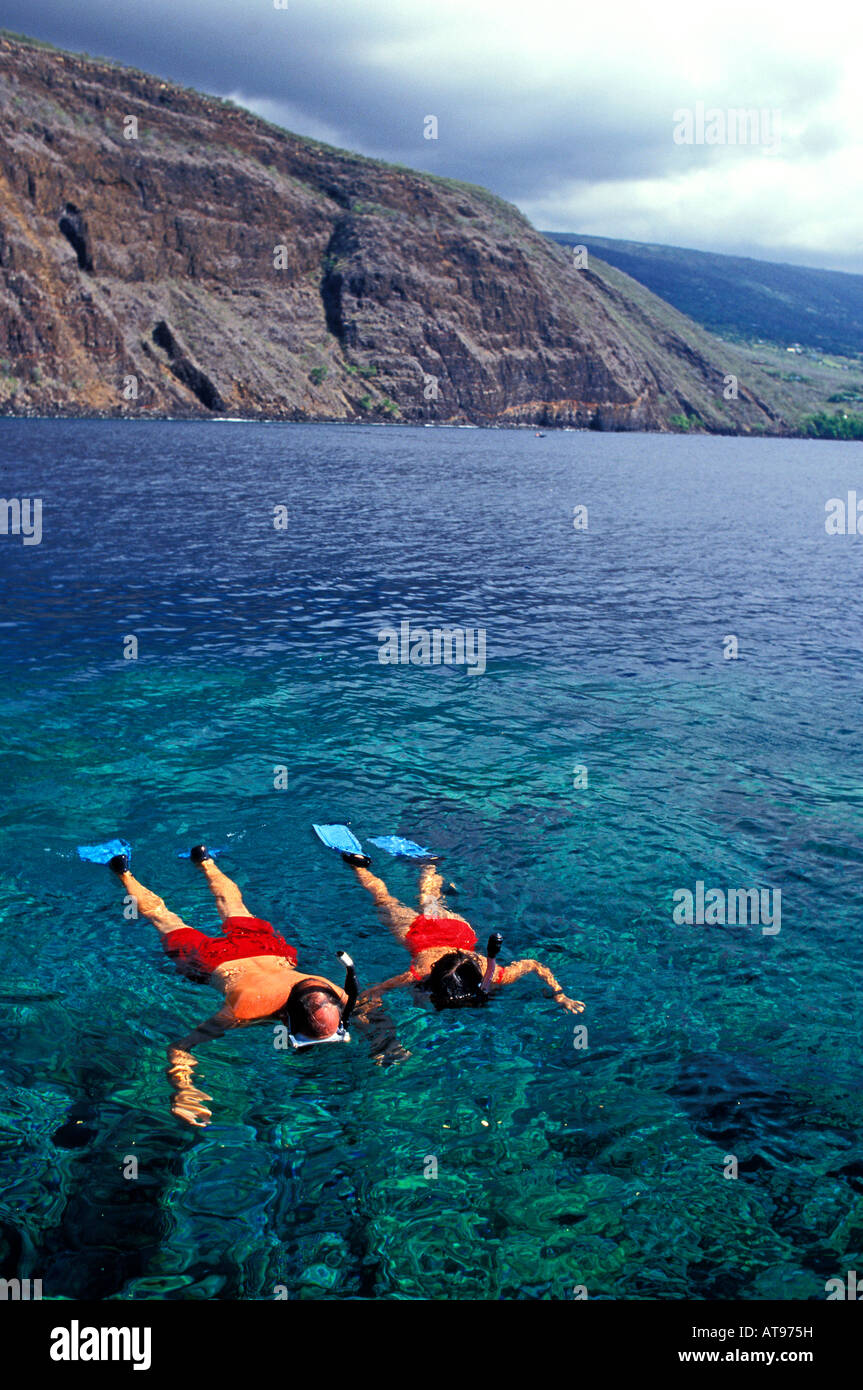 A couple enjoying the snorkeling near Captain Cook Monument , Kealakekua Bay on the Big Island