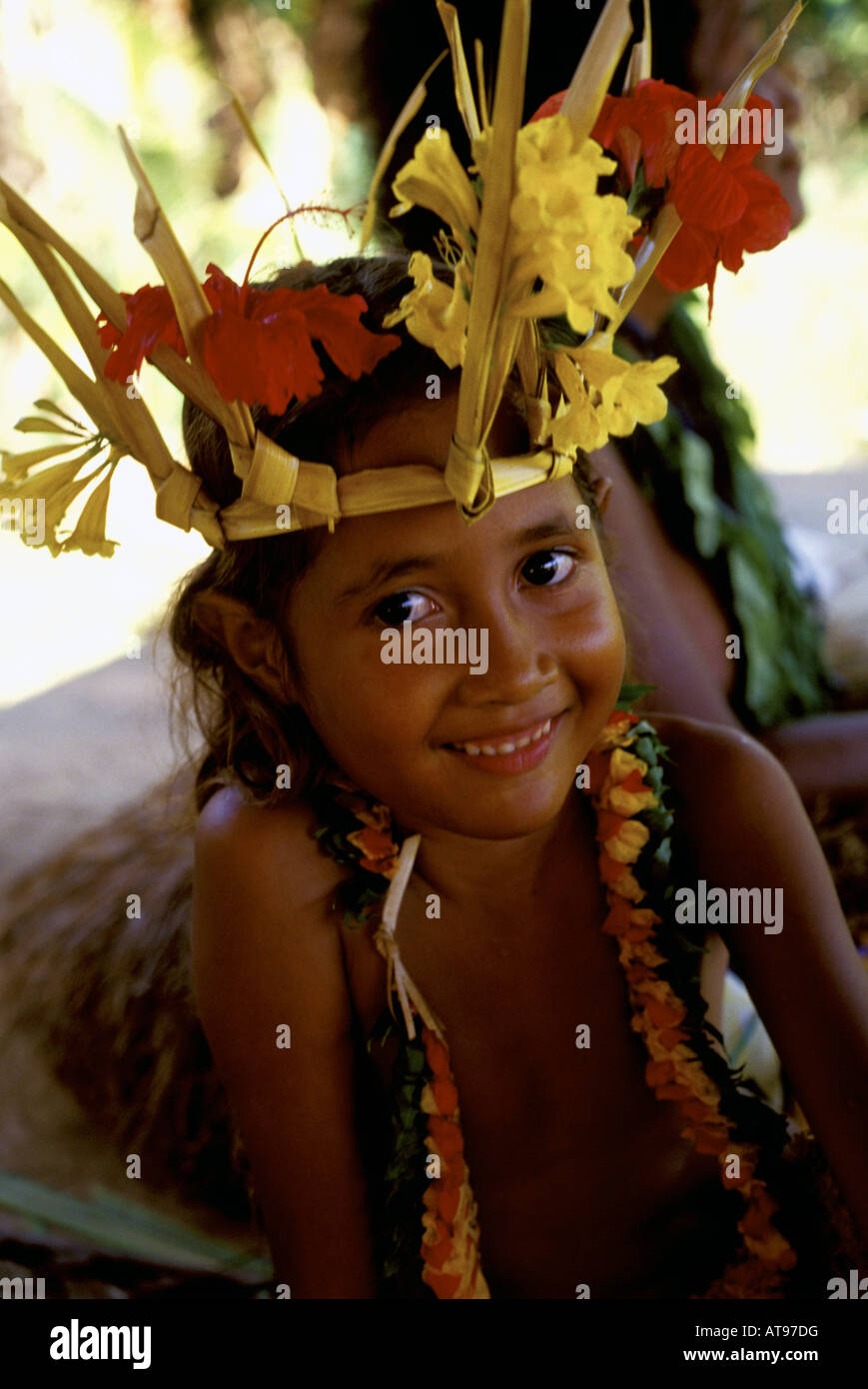 Young native girl wearing traditional ceremonial costume prepares for dance in Ma Village, Yap, Micronesia. Stock Photo