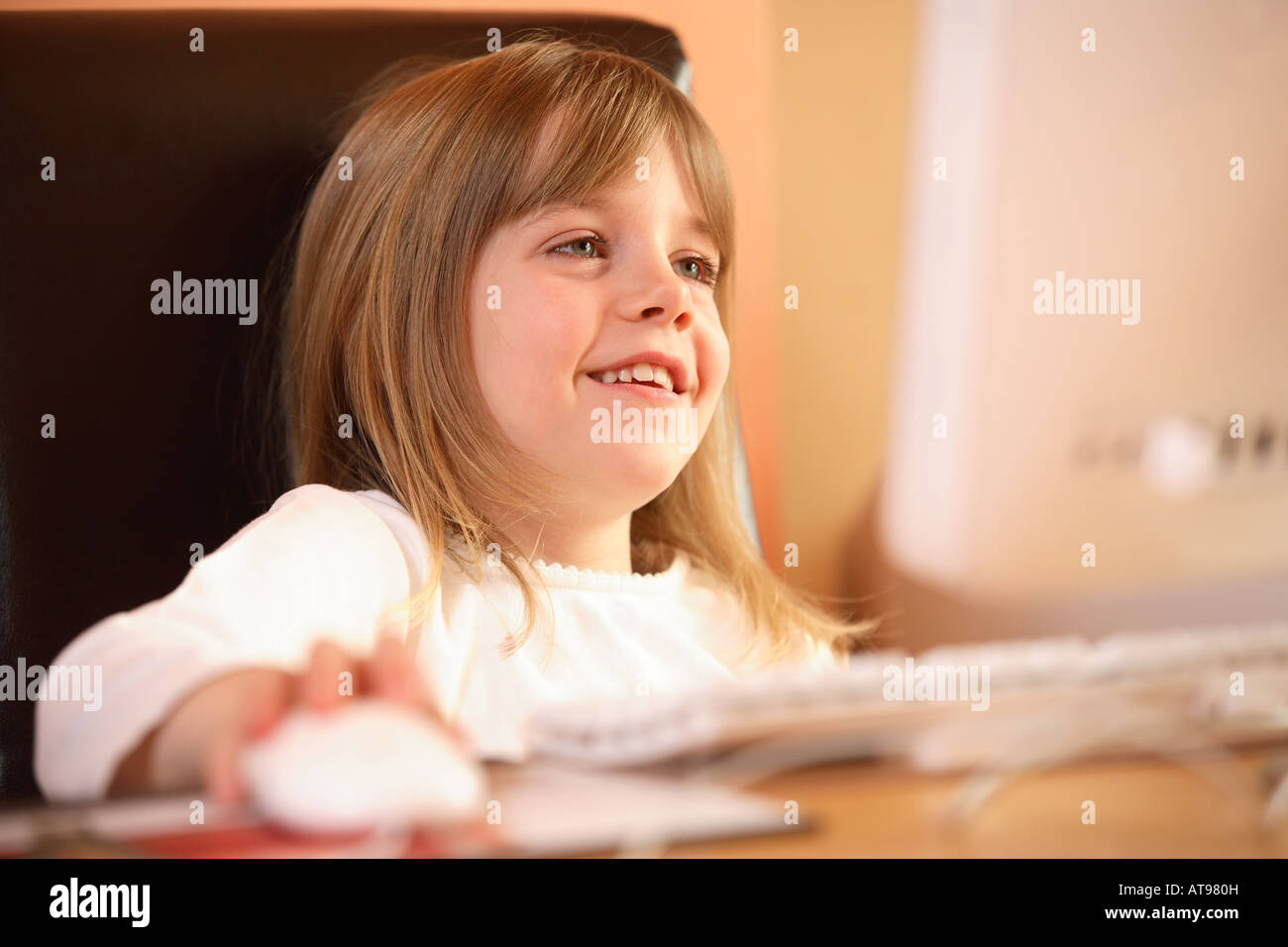 Child working at a computer Stock Photo