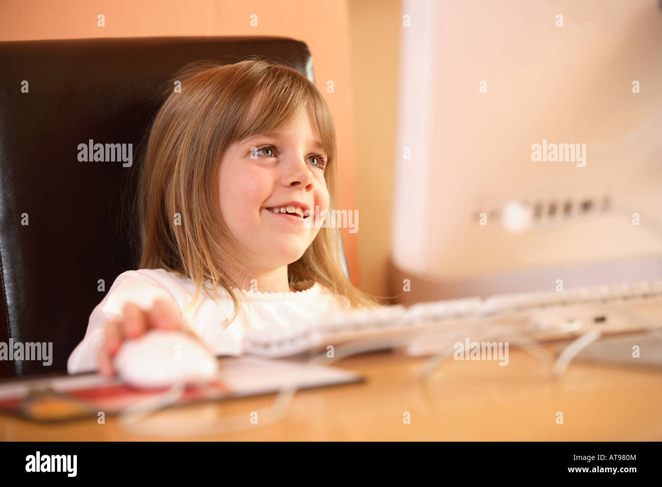 Child working at a computer Stock Photo