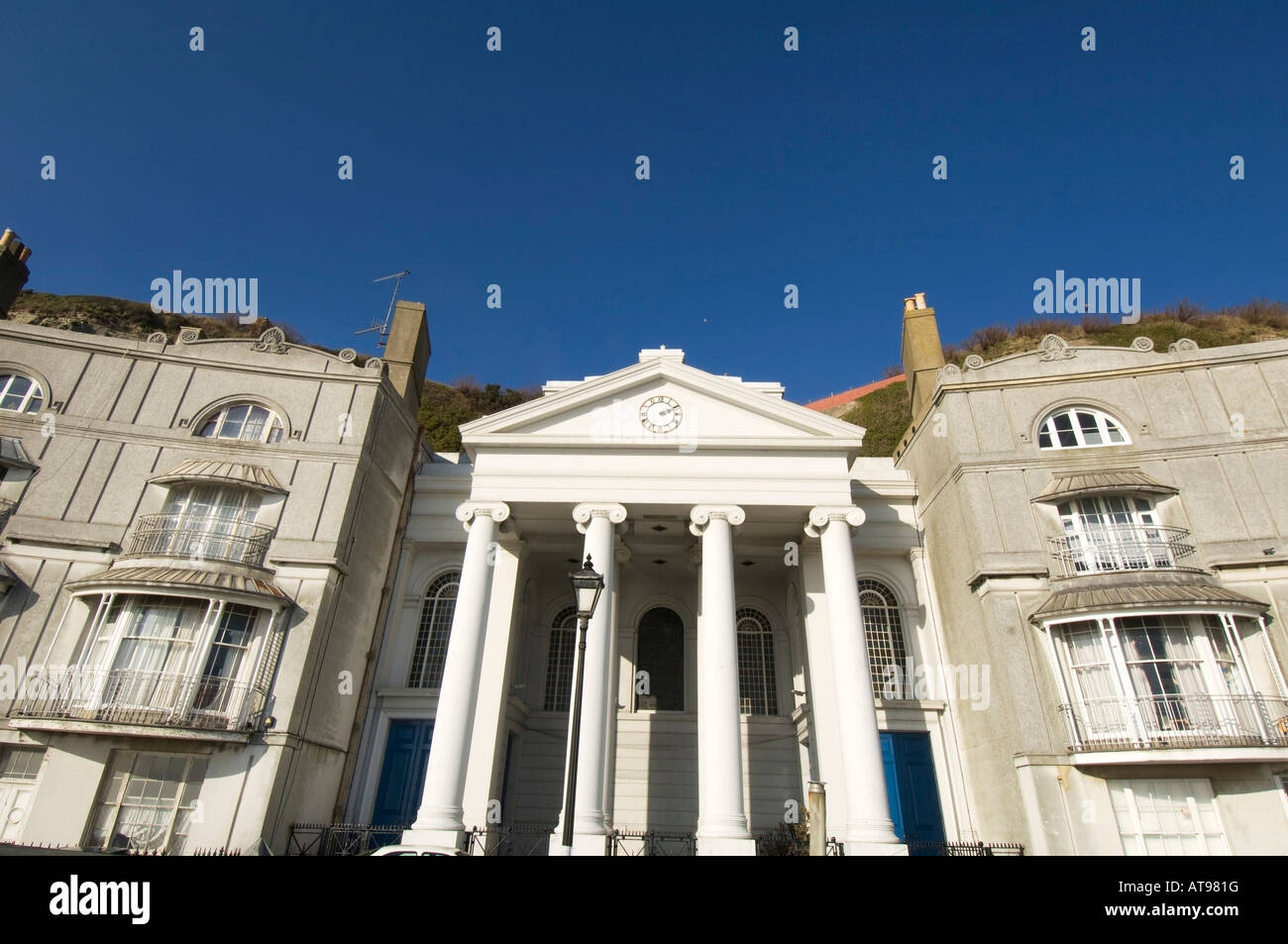 Georgian Pelham Crescent on the seafront in Hastings East Sussex UK with St Mary In The Castle Church Stock Photo
