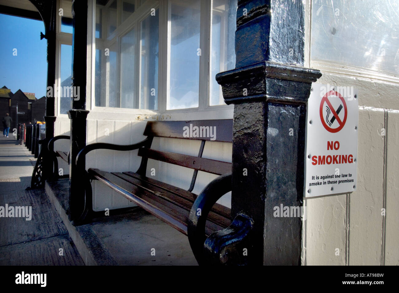 A No Smoking sign on a beach side promenade shelter on the seafront in Hastings East Sussex UK Stock Photo
